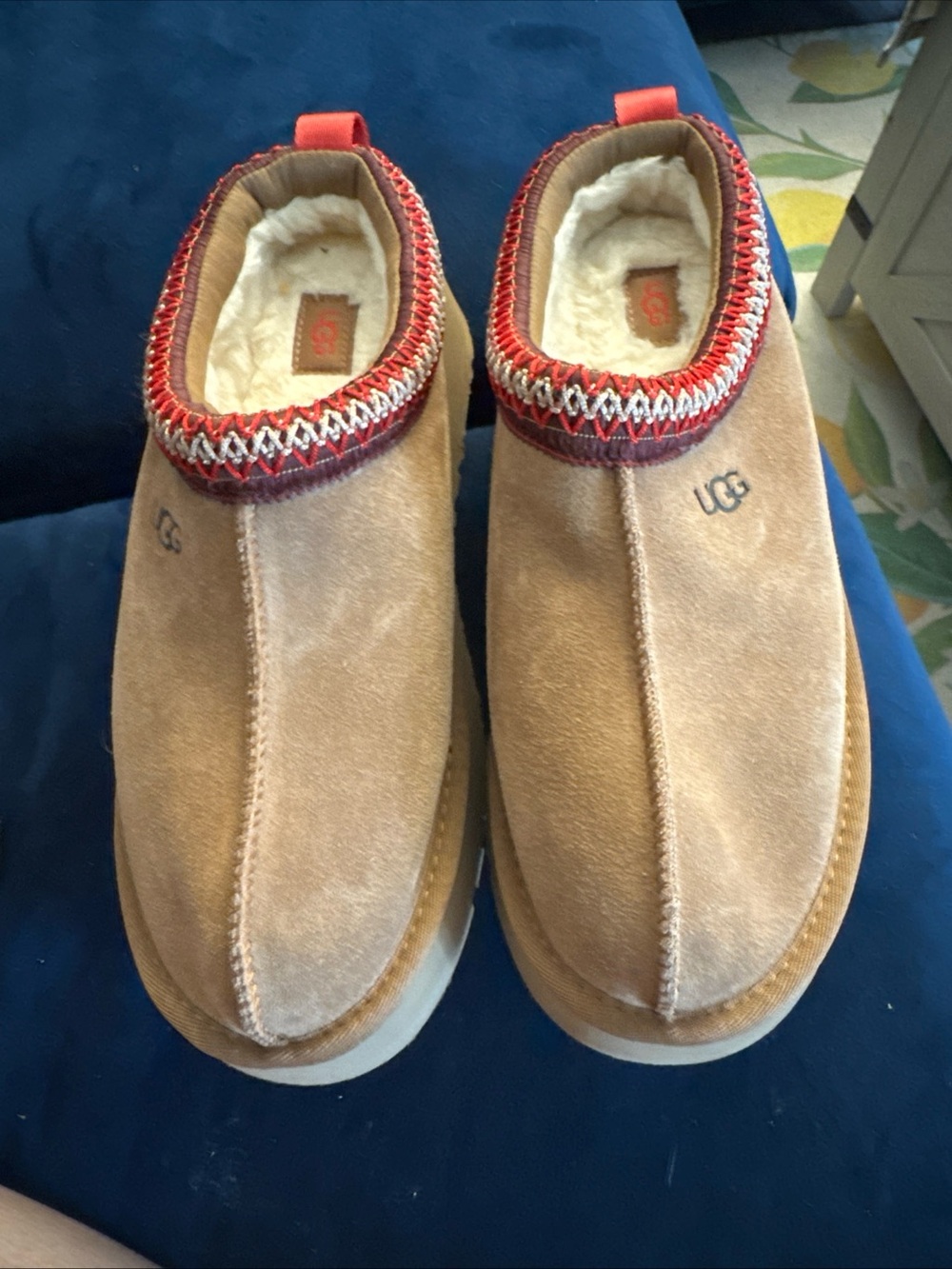 UGG Slip-On Suede Shearling Lined Slippers in Chestnut with Red Trim